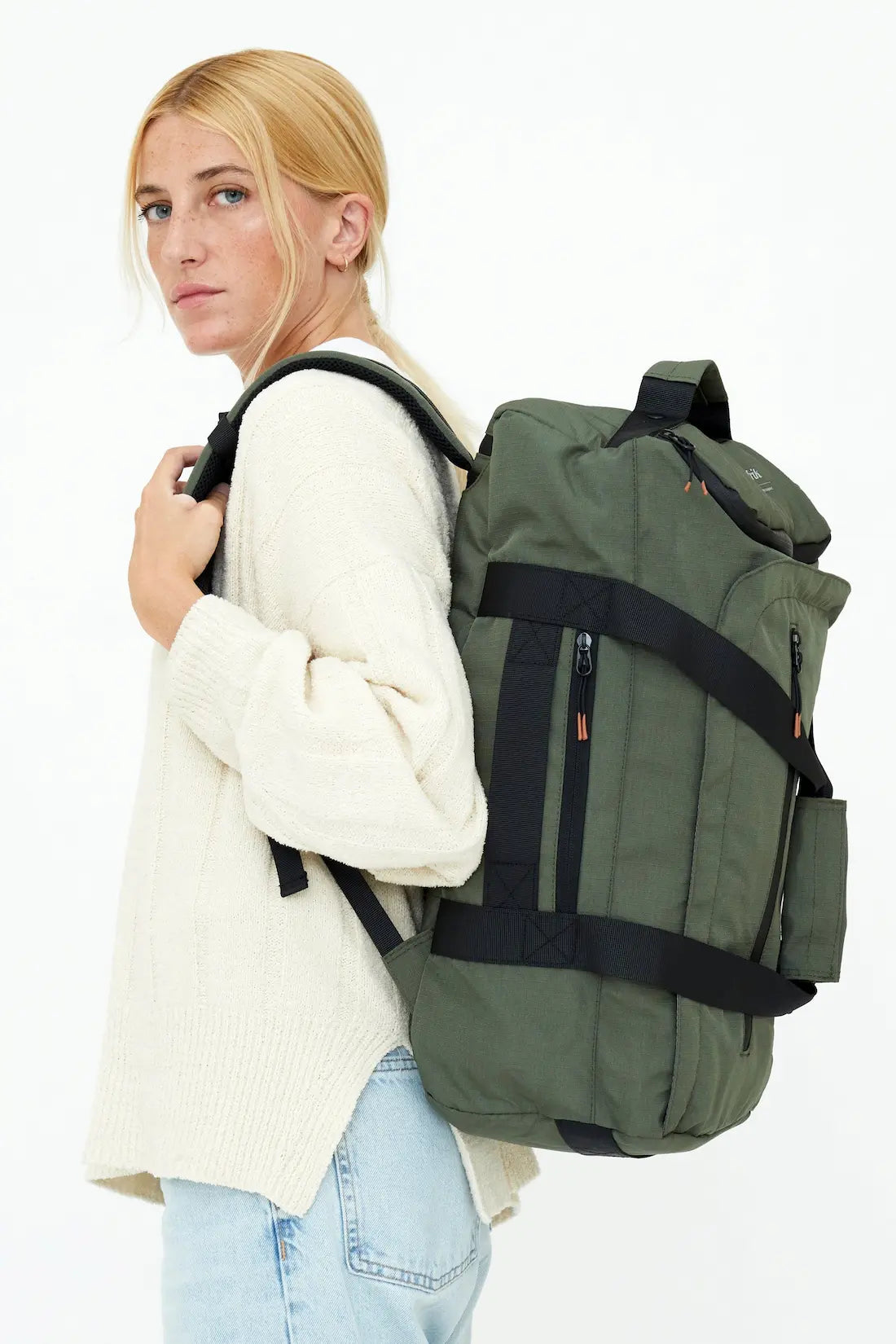 Woman with green lefrik wanderer backpack
